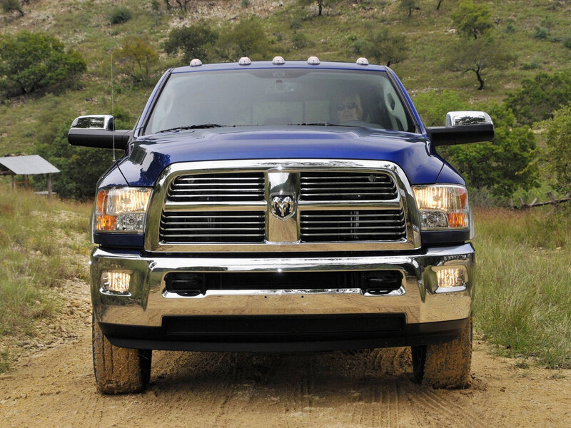 blue ram pickup truck on dirt road