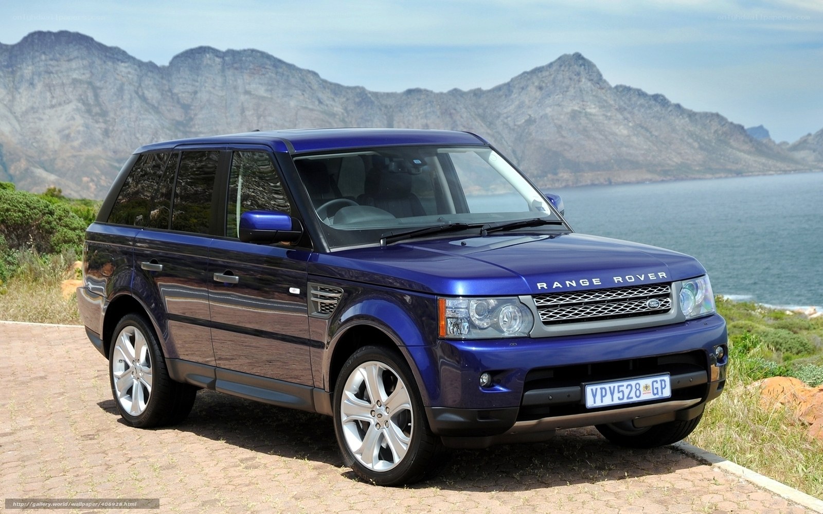 Blue Range Rover by the coast
