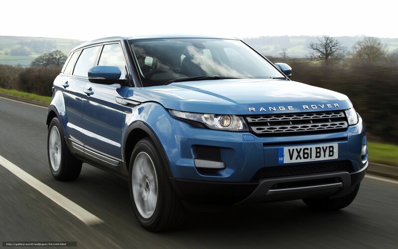 Blue Range Rover driving on road
