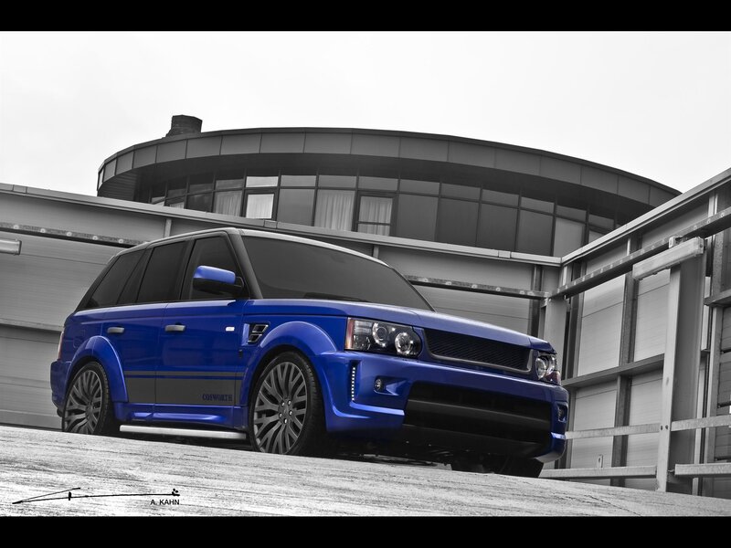 Blue Range Rover in front of building