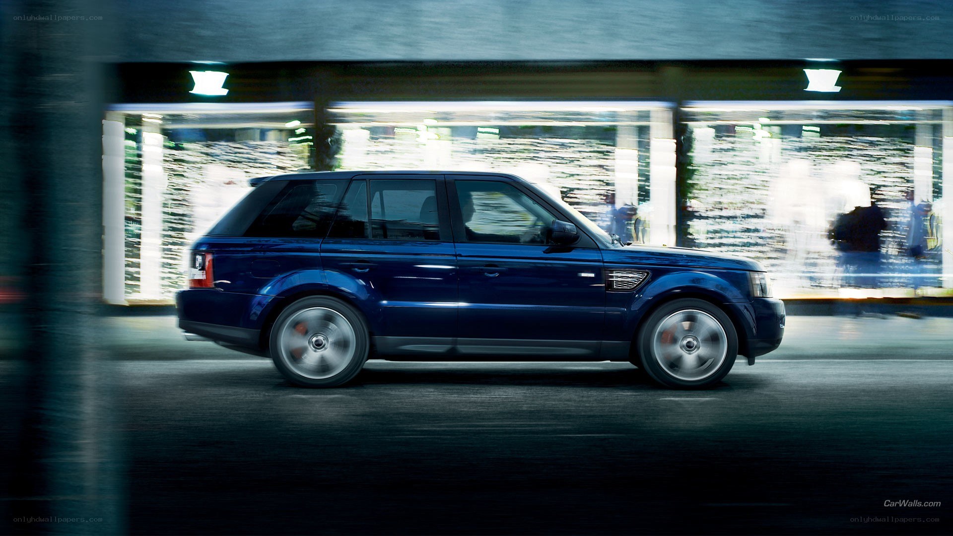 blue range rover in motion