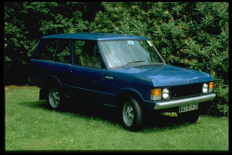blue range rover on grass
