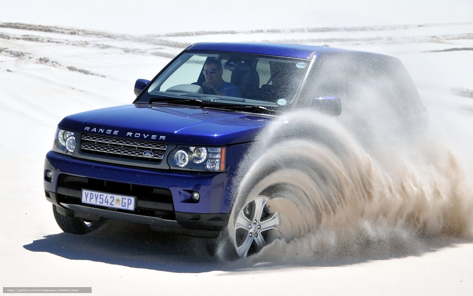 Blue Range Rover on sand dunes