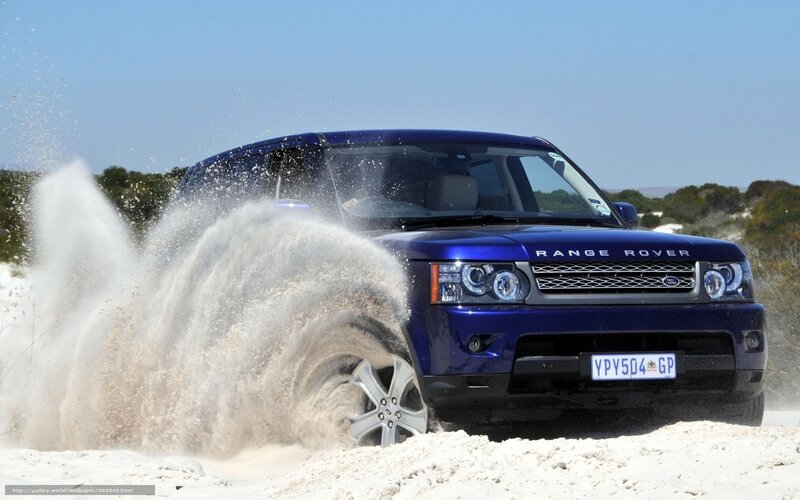 Blue Range Rover on sand