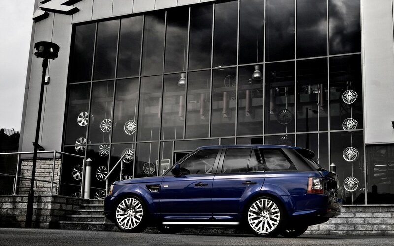 Blue Range Rover Suv — Dramatic, Photograph, Car Dealership