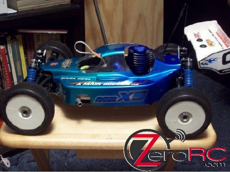 blue rc car on wooden stand