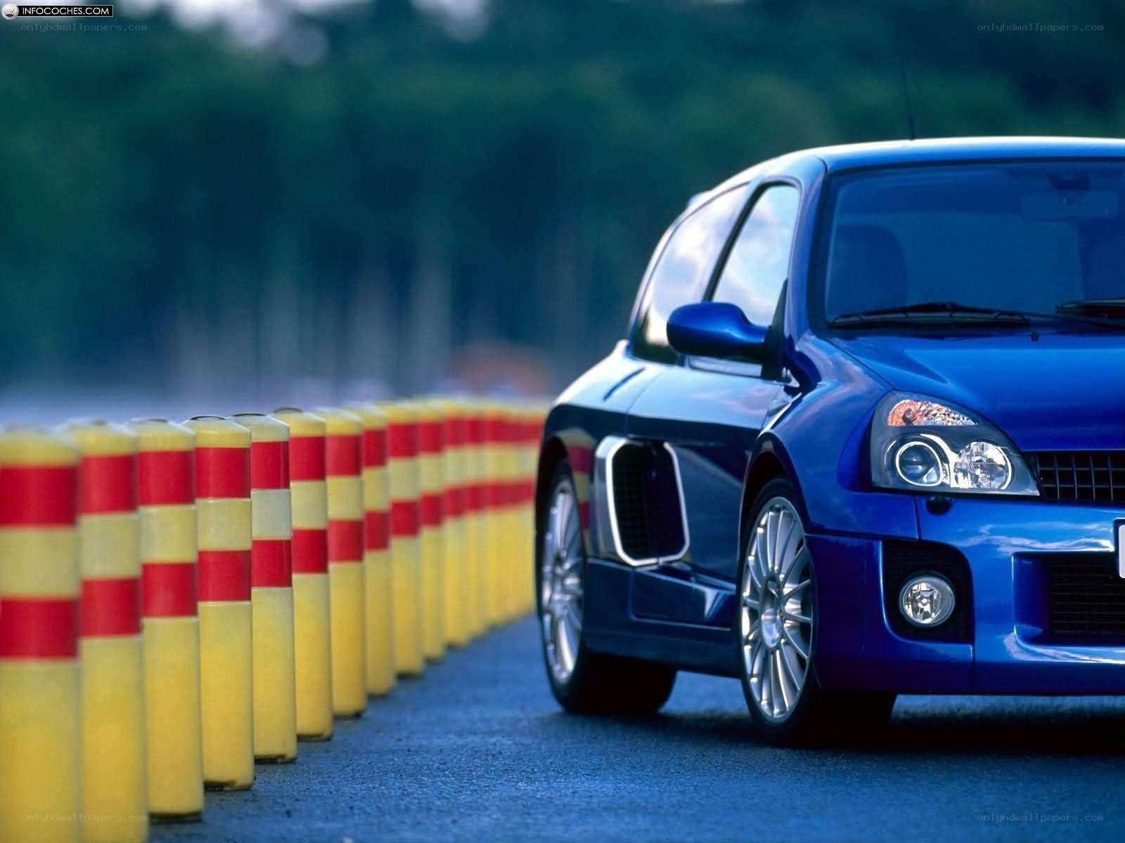 Blue Renault Clio on a track