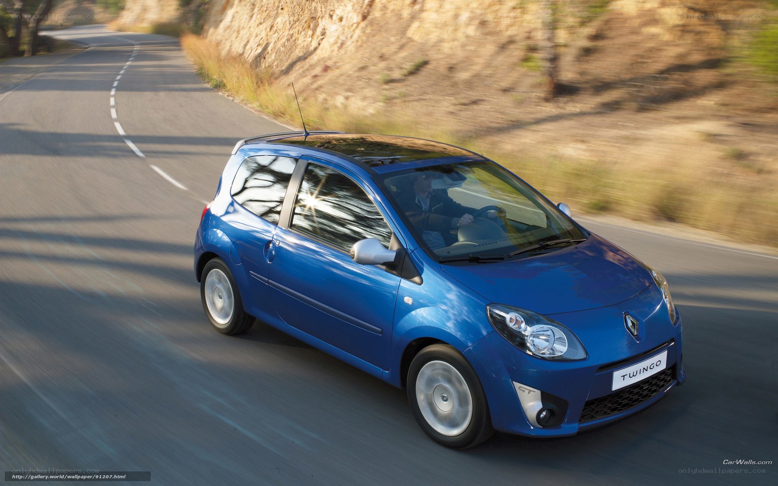 Blue Renault Twingo on a winding road