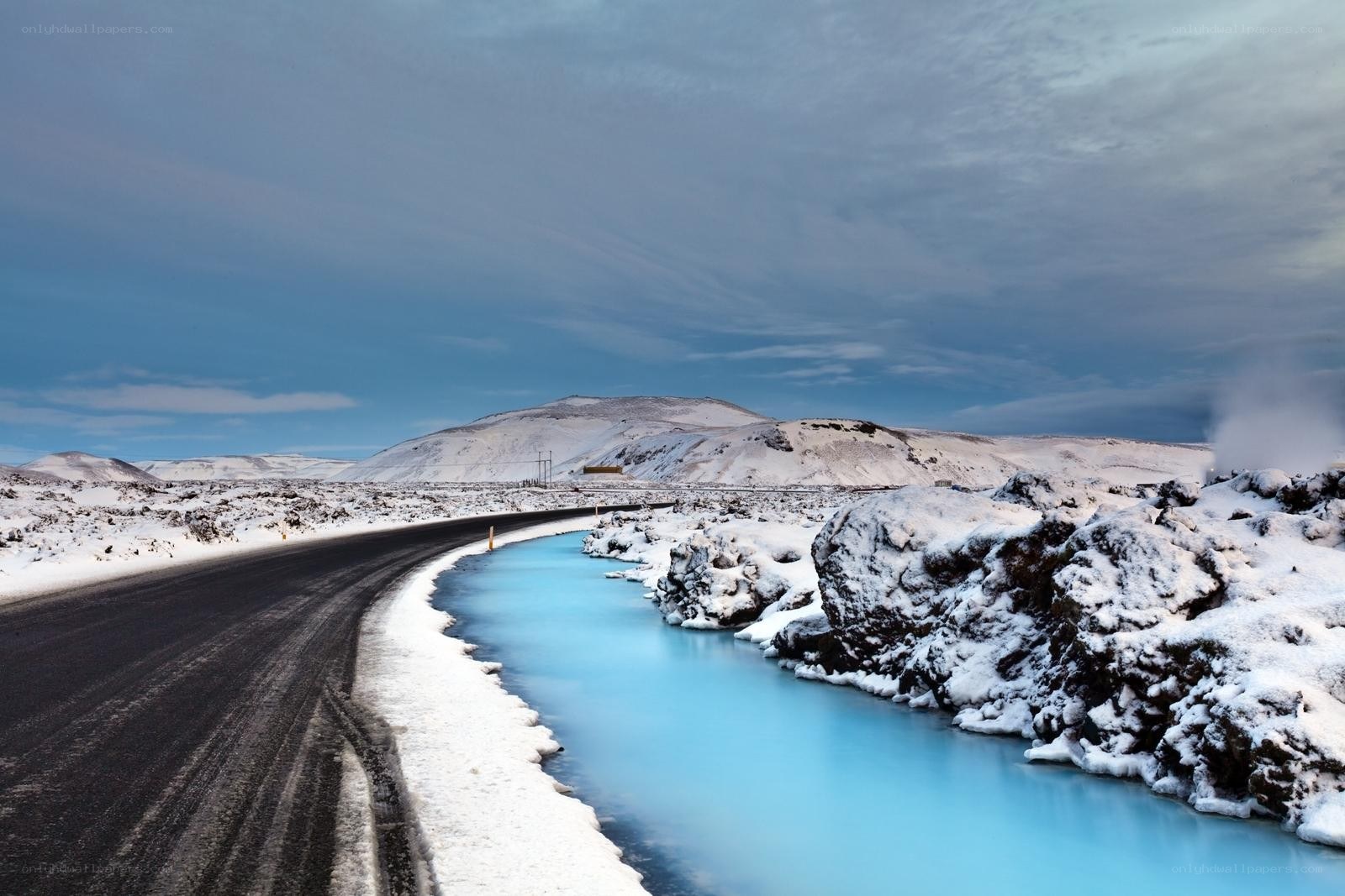 Blue river in snowy landscape