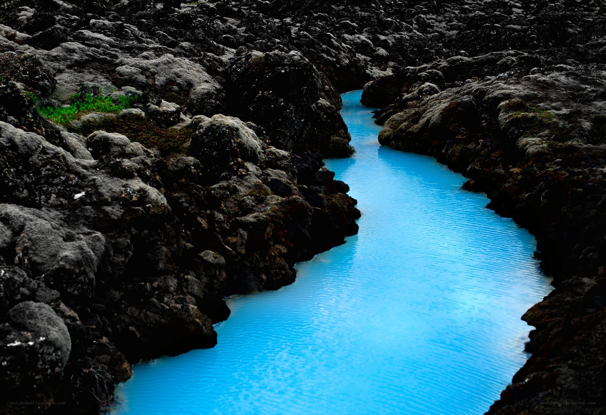 Blue river in volcanic rock