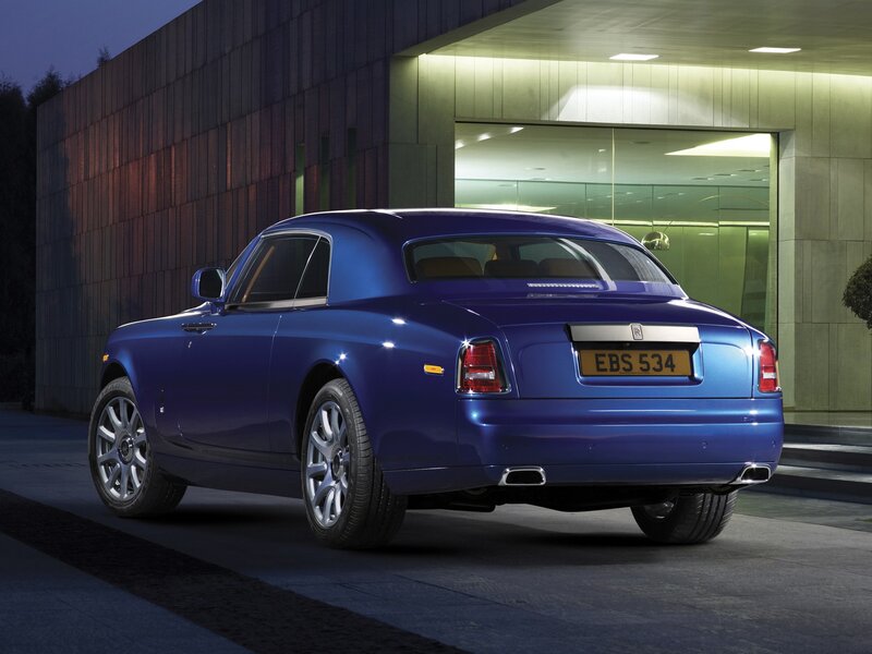 Blue Rolls-Royce at night