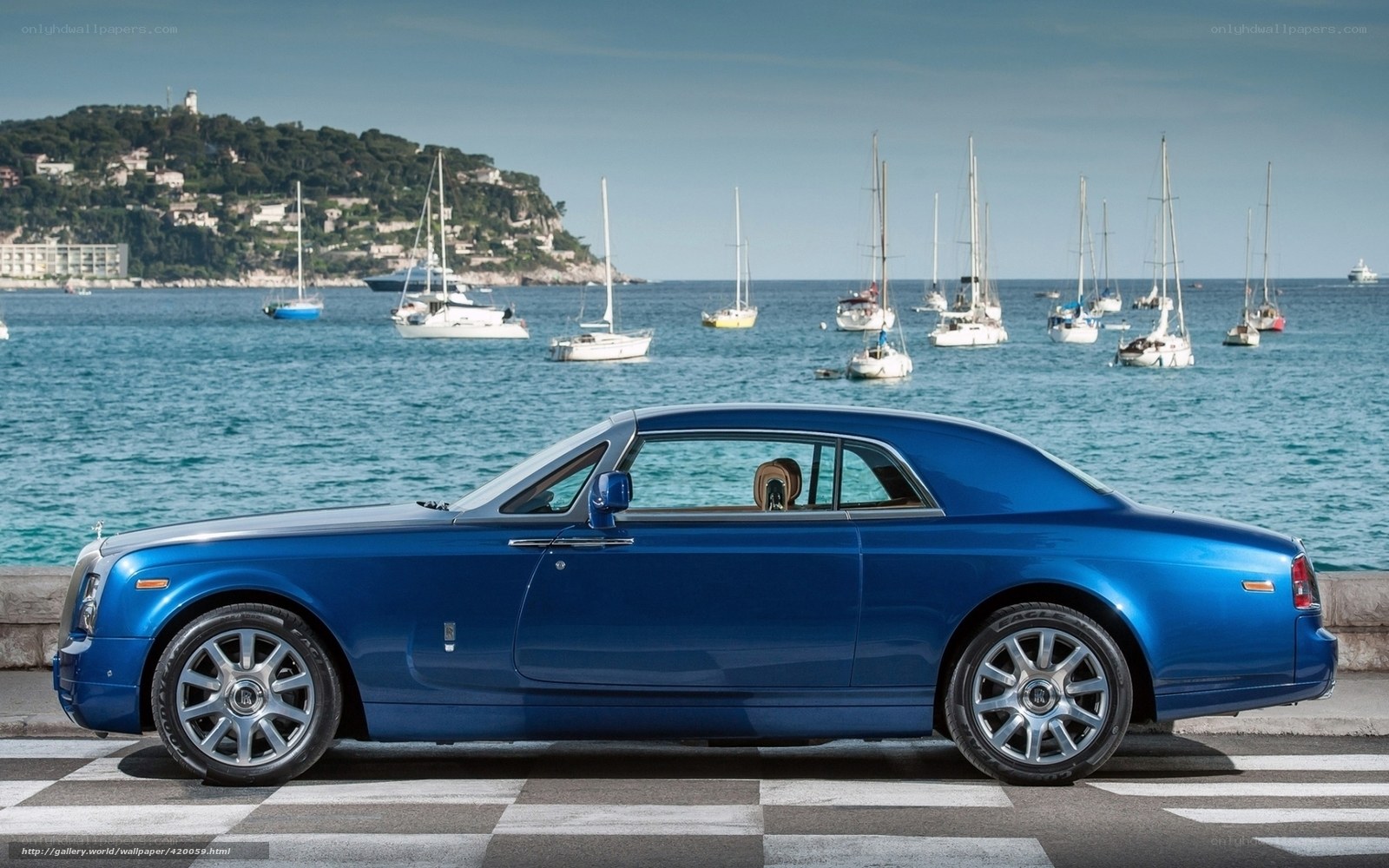 Blue Rolls-Royce by the sea