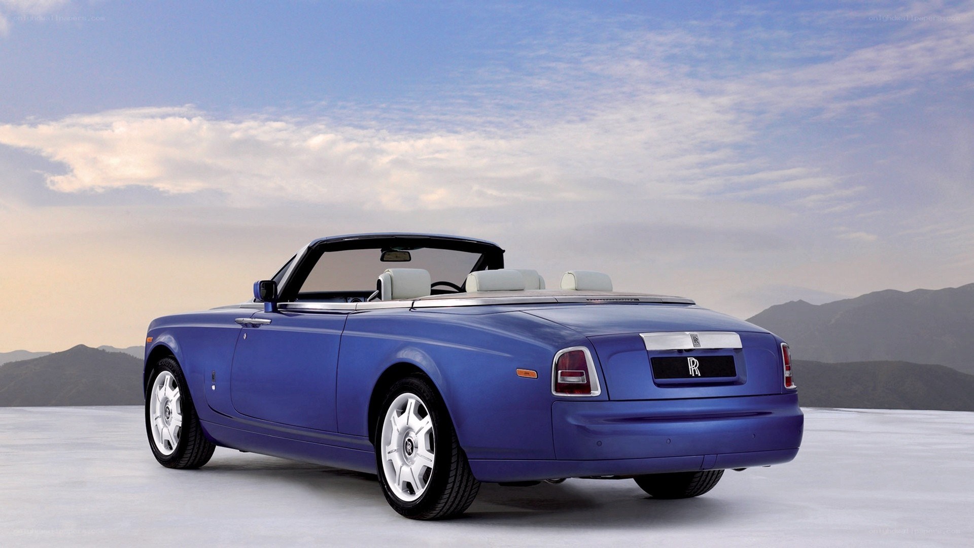 blue rolls-royce convertible