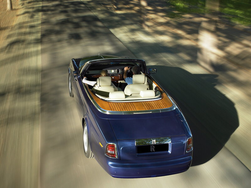 Blue Rolls-Royce convertible driving