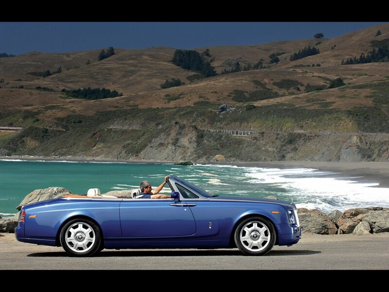 Blue Rolls-Royce convertible on coast