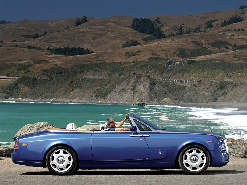 Blue Rolls-Royce convertible on coast