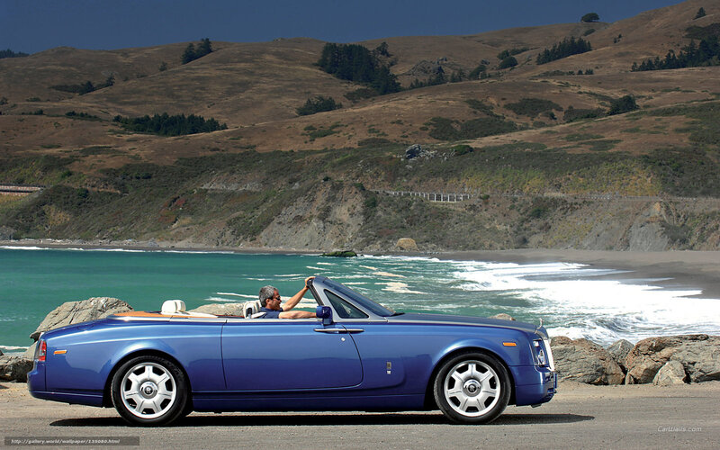 Blue Rolls-Royce convertible on coast