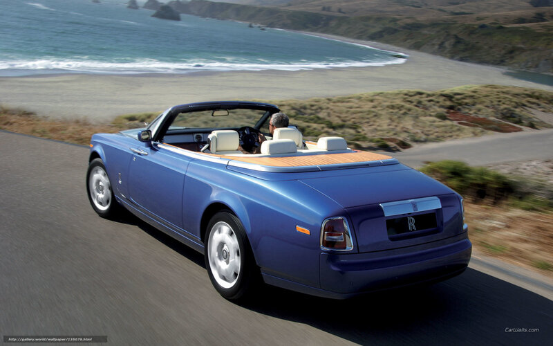Blue Rolls-Royce convertible on coastal road
