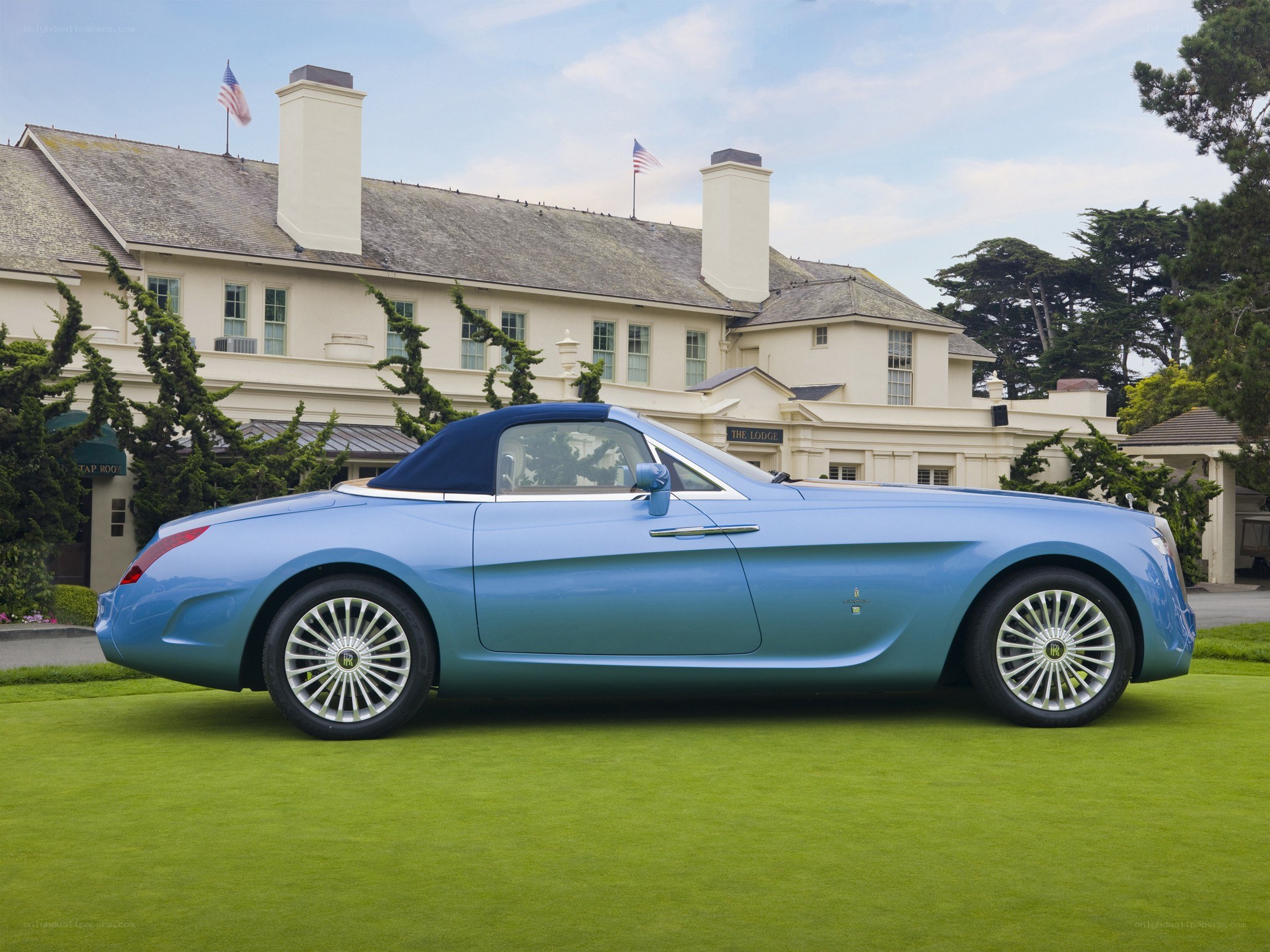 Blue Rolls-Royce convertible on lawn