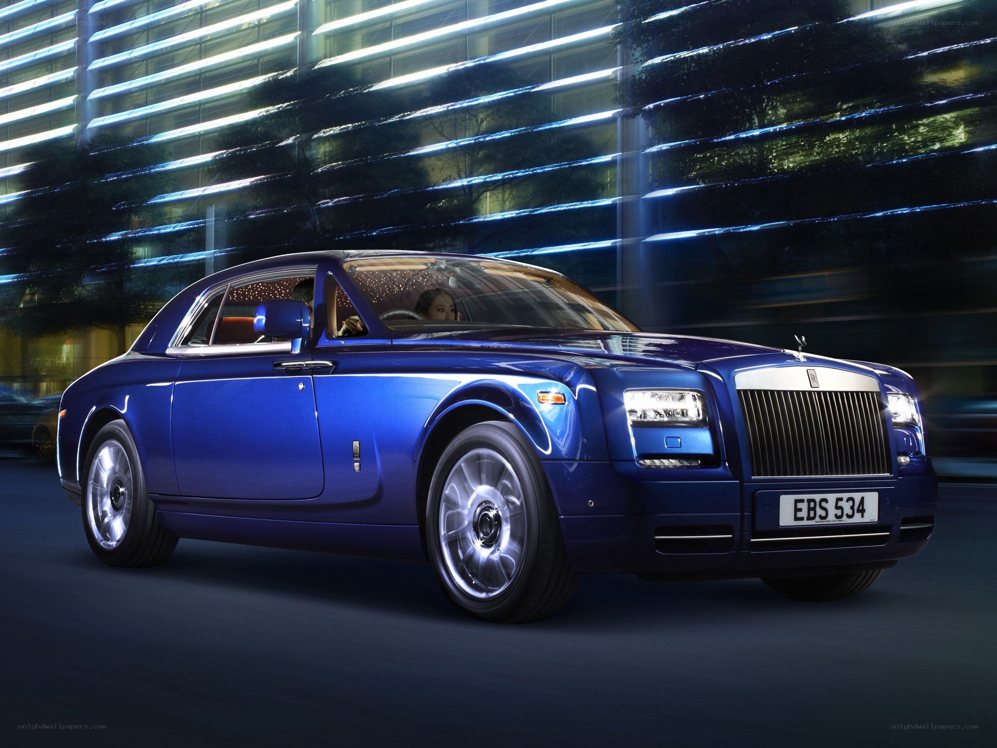 Blue Rolls-Royce in city