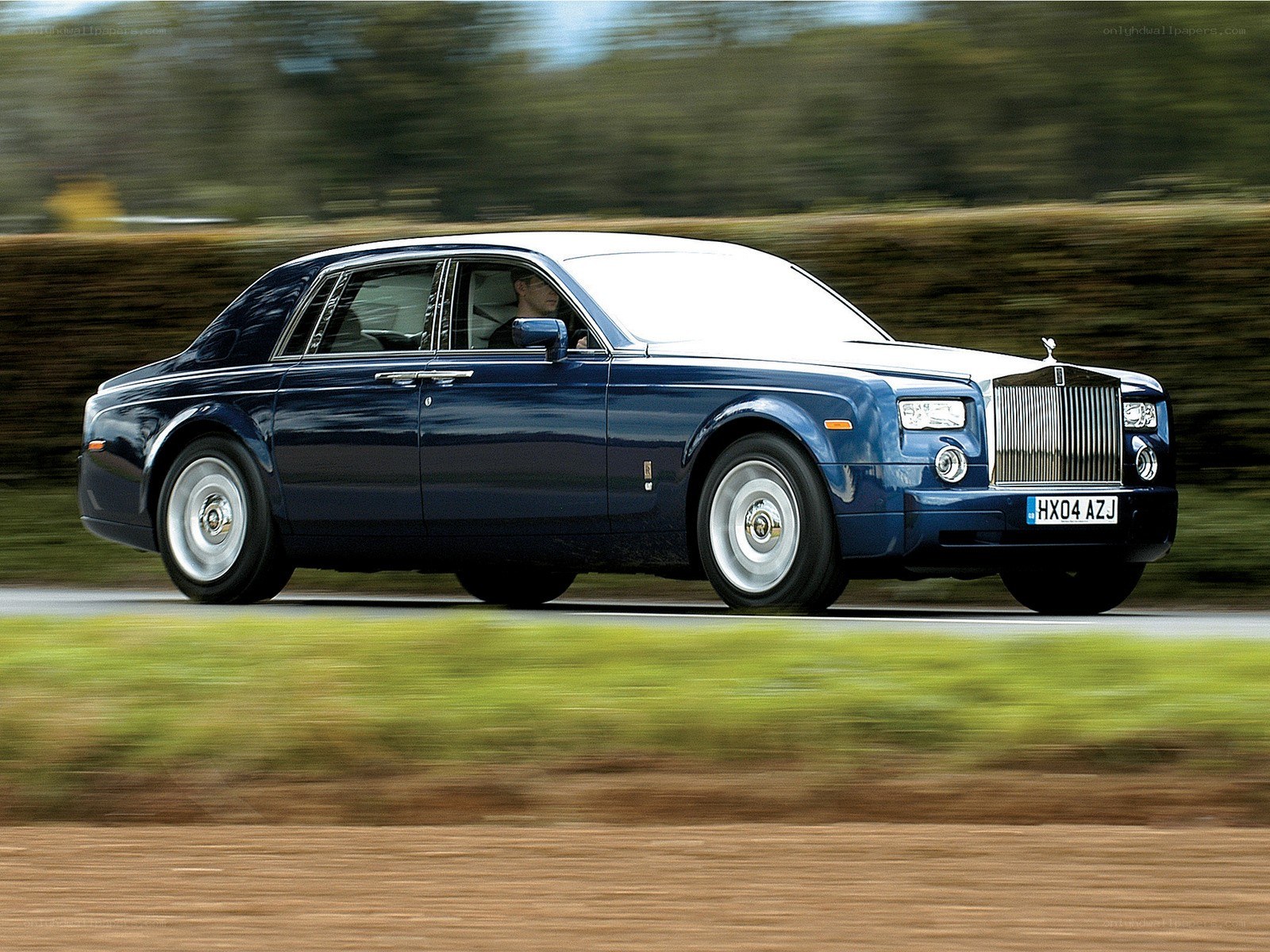 Blue Rolls-Royce in motion