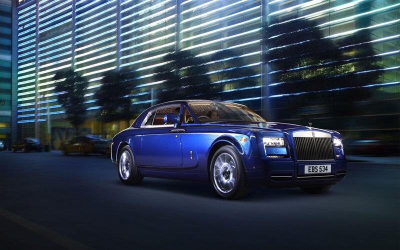 Blue Rolls-Royce on city street