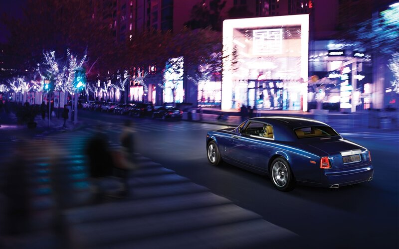 Blue Rolls-Royce on city street