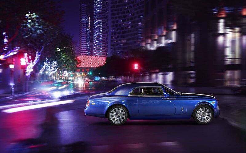 Blue Rolls-Royce on city street