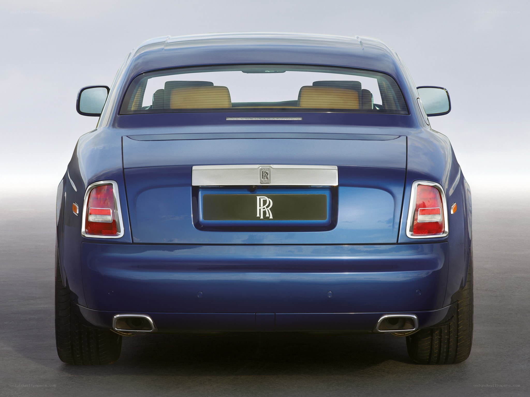 blue rolls-royce rear view