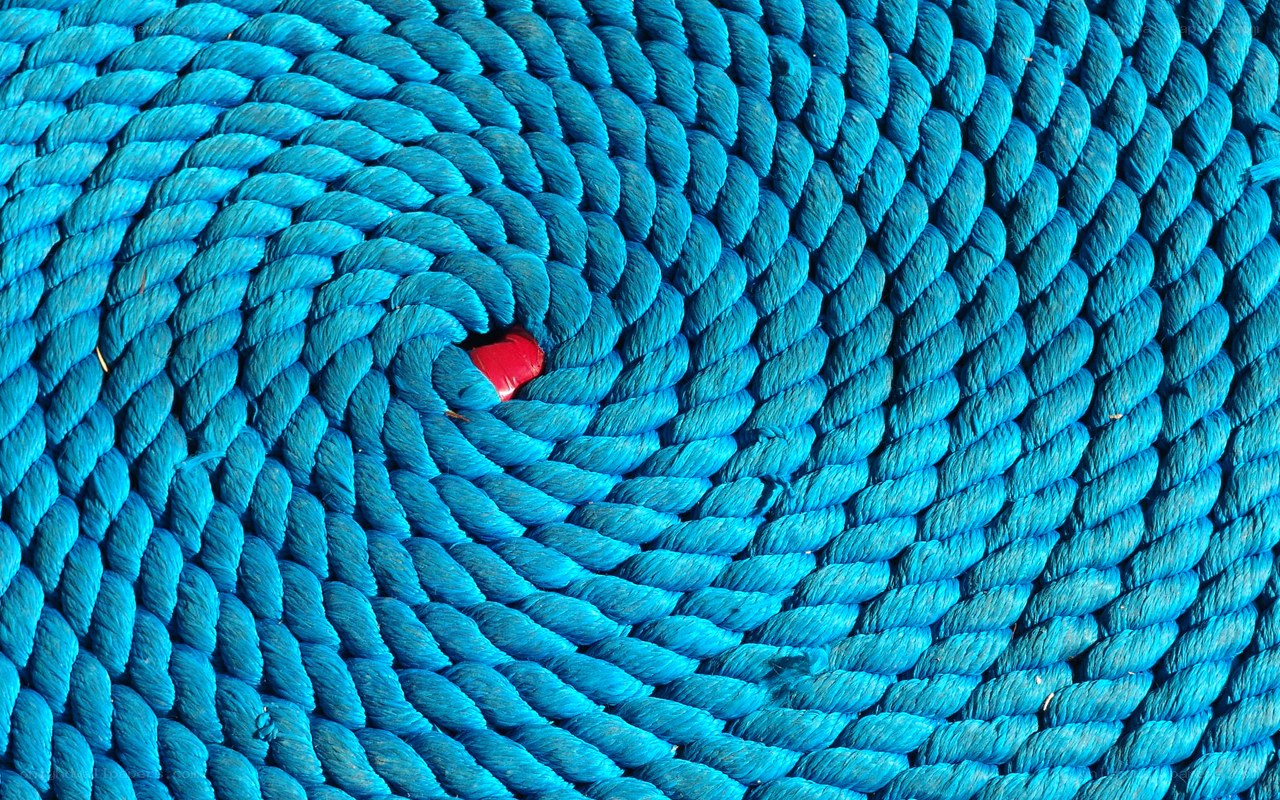 Blue rope coil with red object