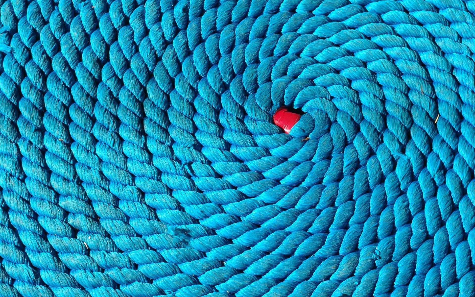 Blue rope coil with red object