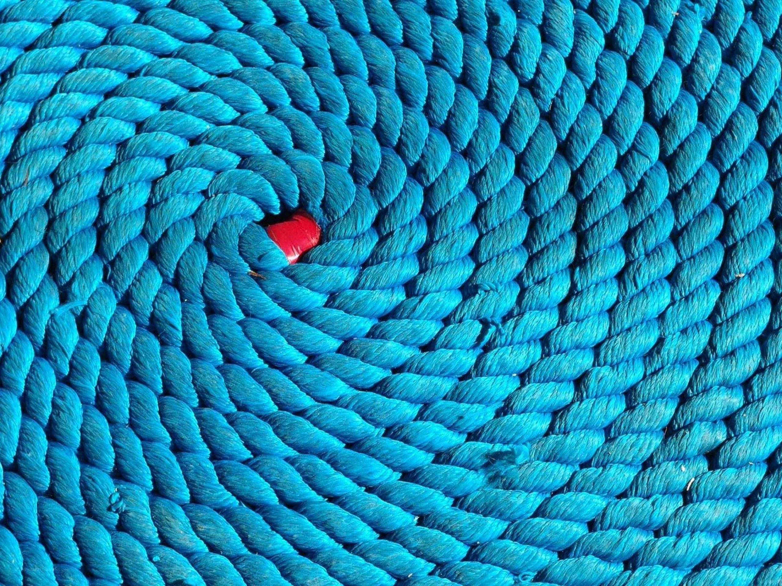 Blue rope coil with red object