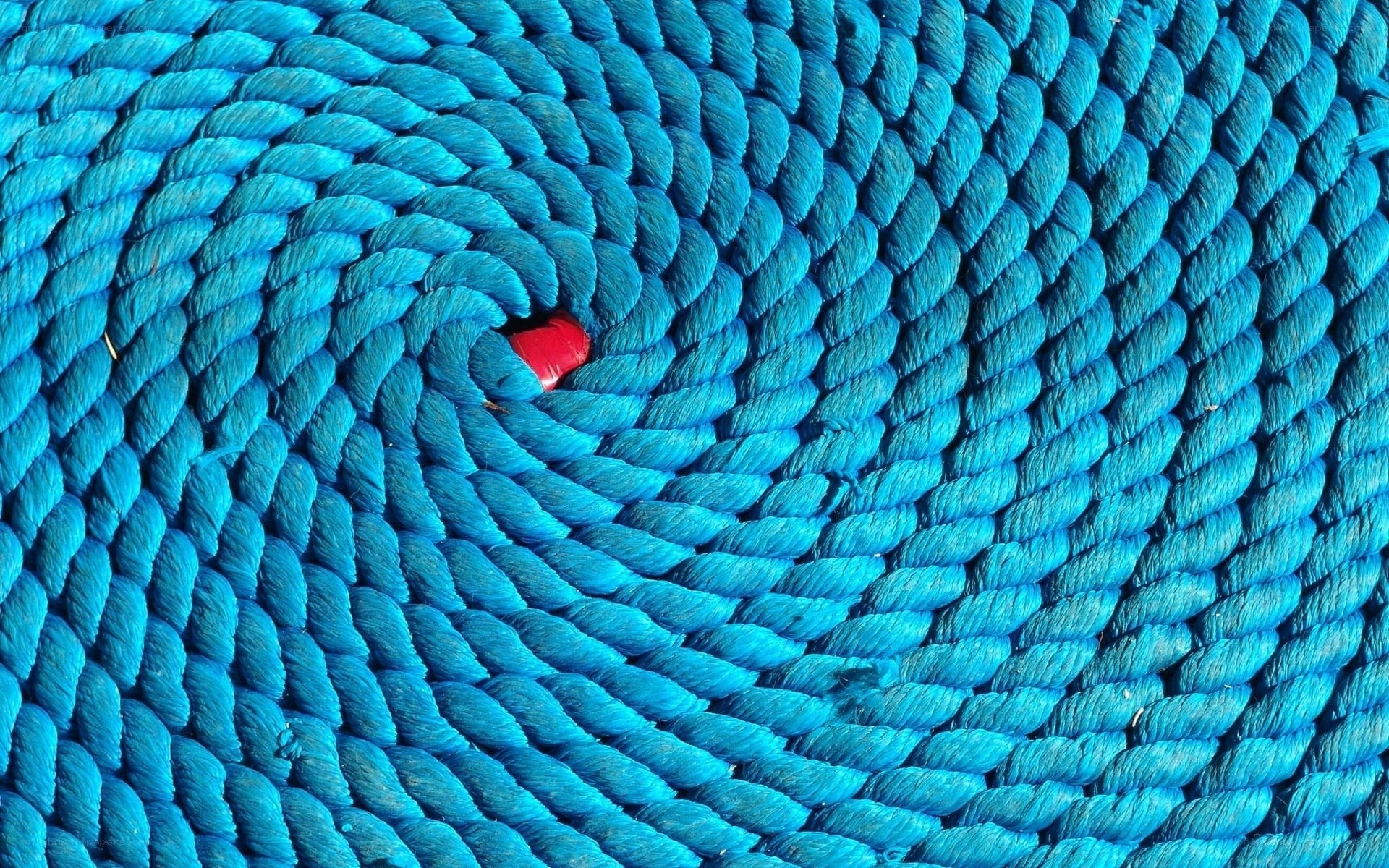 Blue rope coil with red object