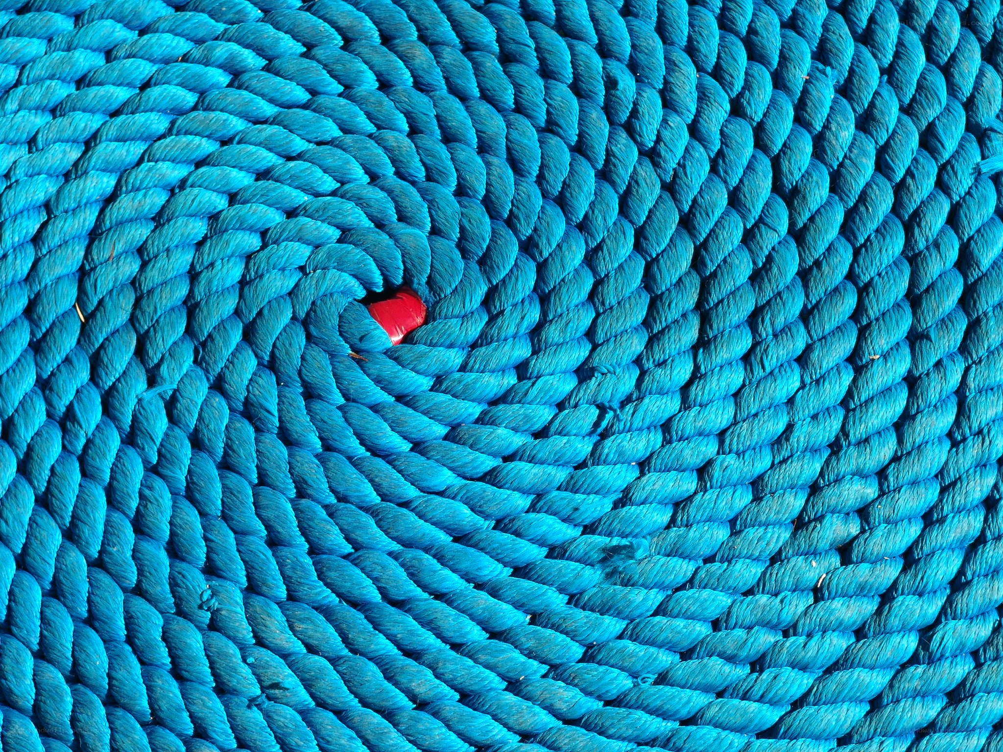 Blue rope coiled in spiral