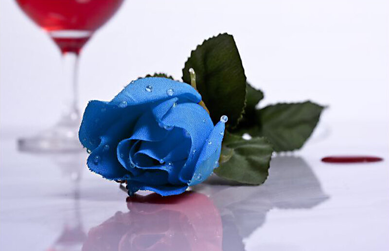 Blue rose with red drink