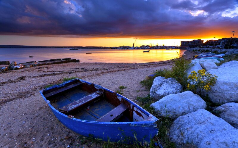 Blue Rowboat on Beach