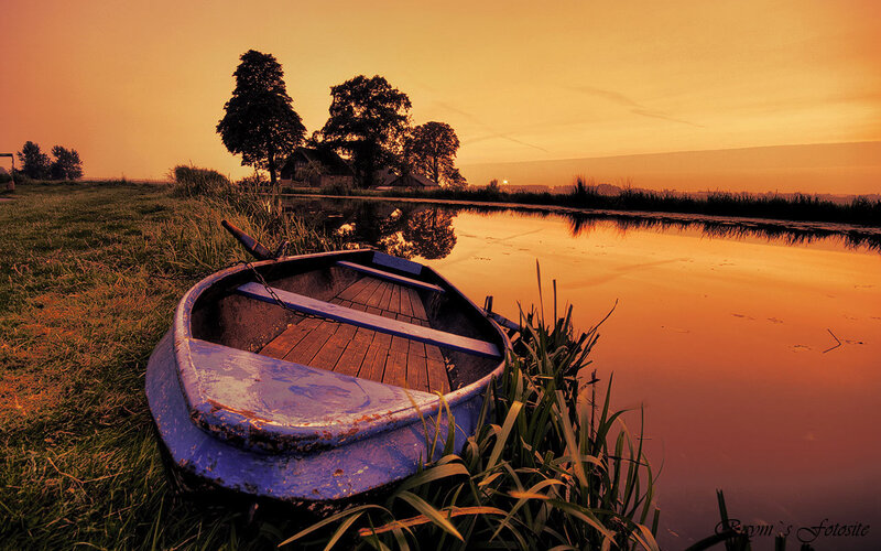 Blue Rowboat on Shore — Orange