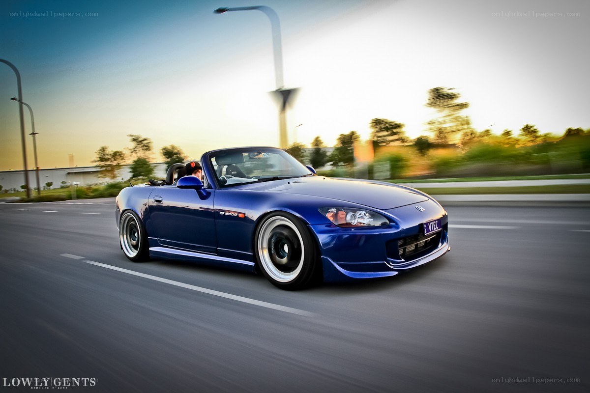 Blue S2000 convertible in motion