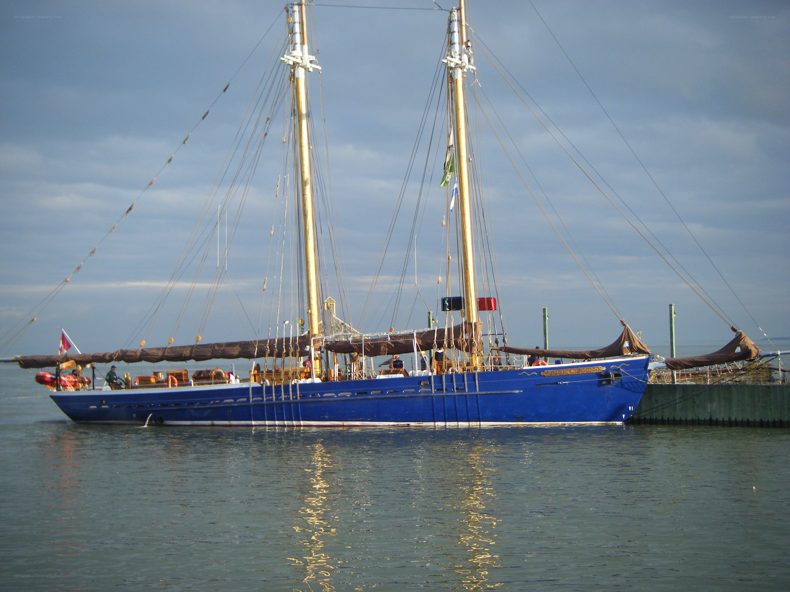 Blue sailboat at the dock