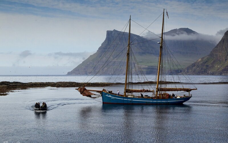 Blue Sailboat in Water