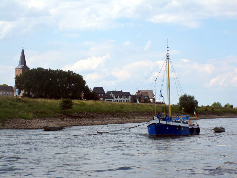 Blue Sailboat on River