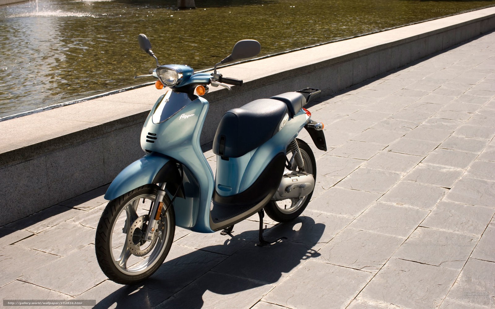 Blue scooter by a fountain