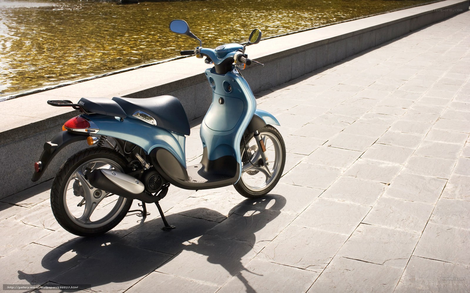 Blue scooter by the water