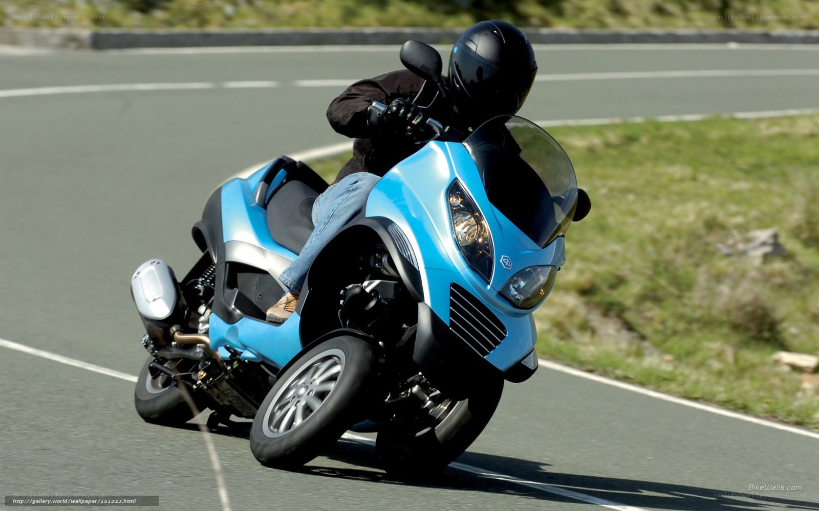 Blue scooter on a road