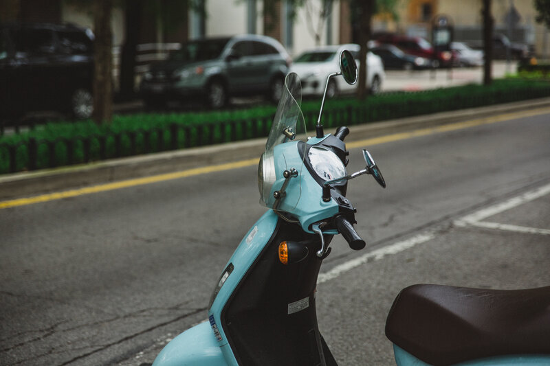 Blue scooter on city street