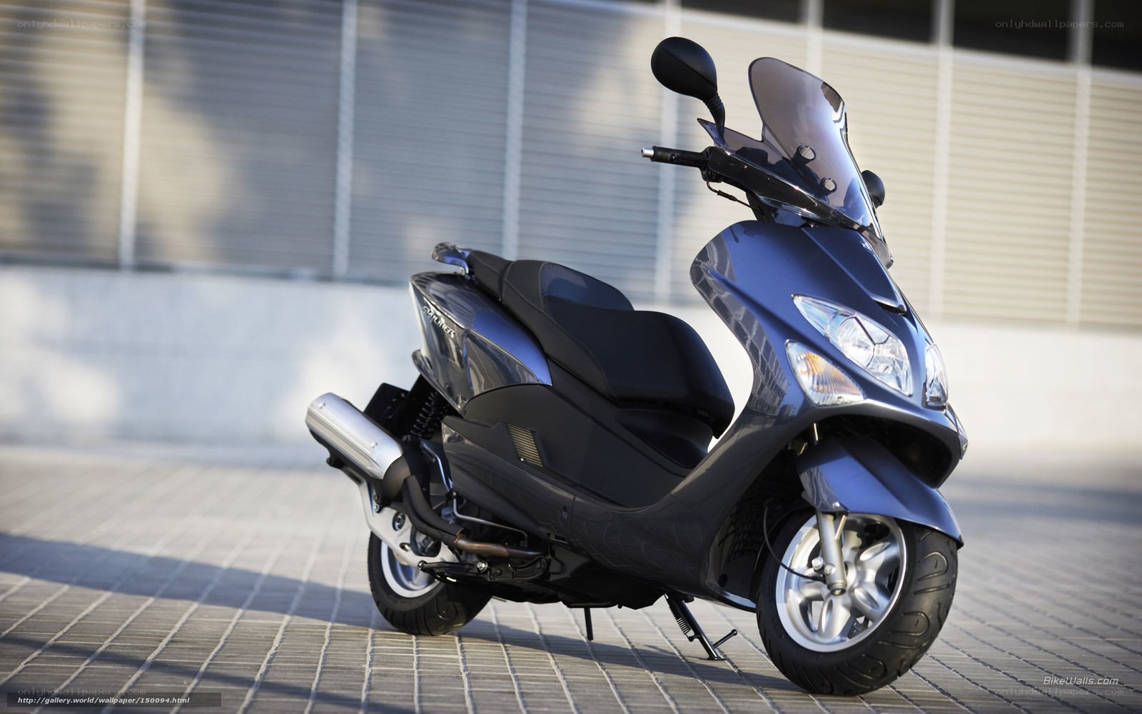 Blue scooter on pavement