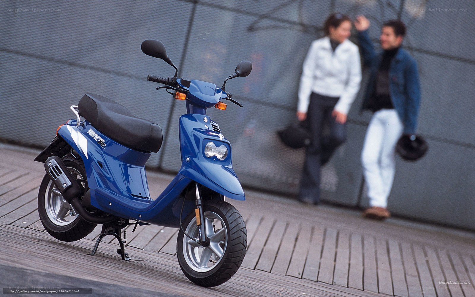 Blue scooter on wooden deck