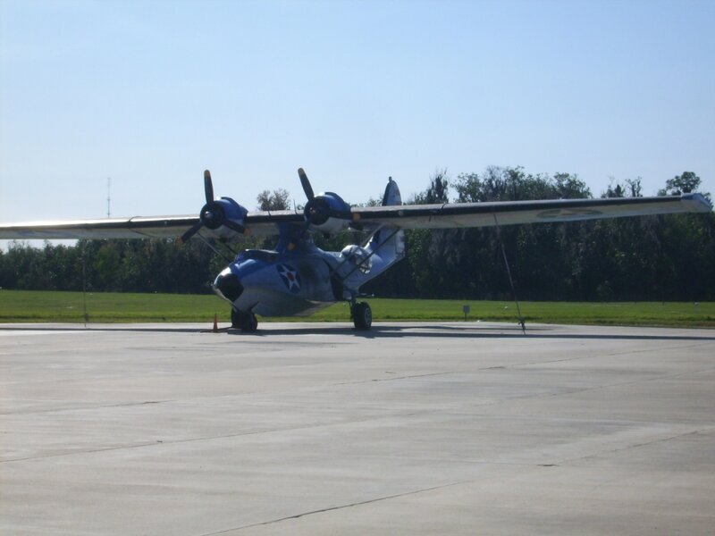 blue seaplane on tarmac