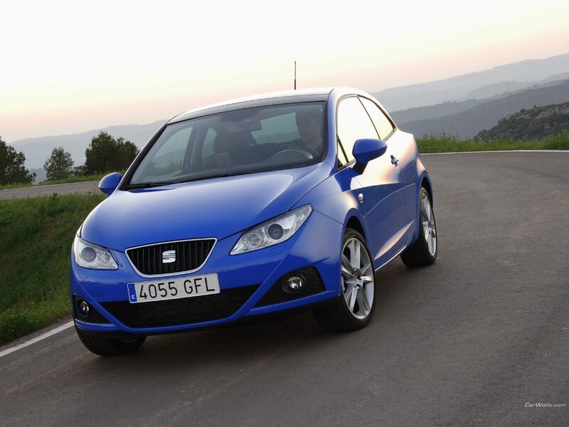 blue seat car on a road