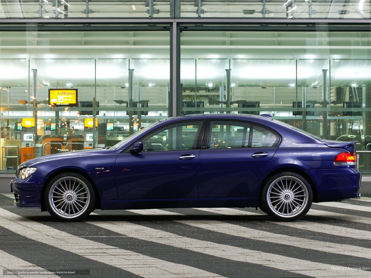blue sedan at airport terminal